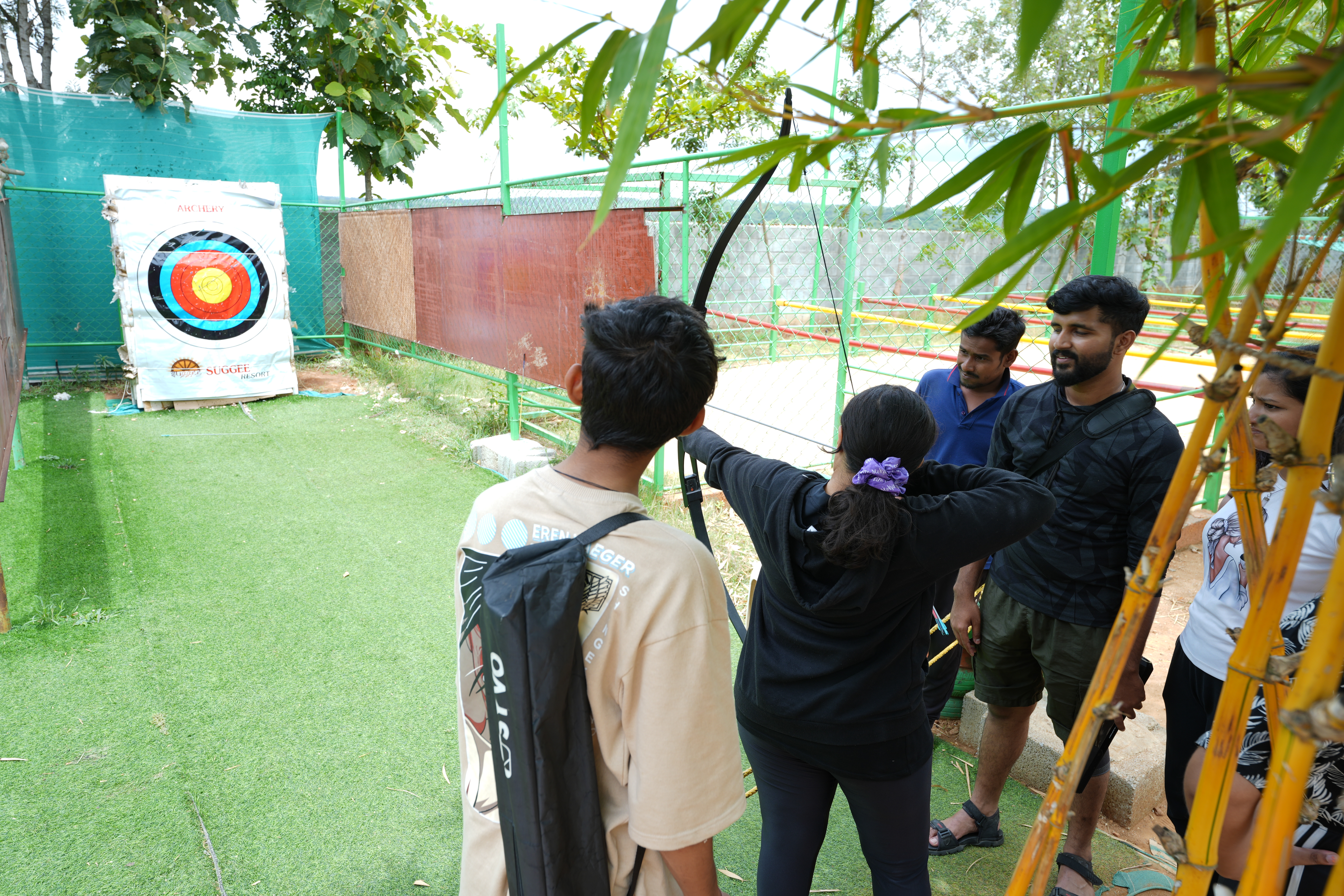 Guest enjoying archery activity at Suggee Resort Bangalore