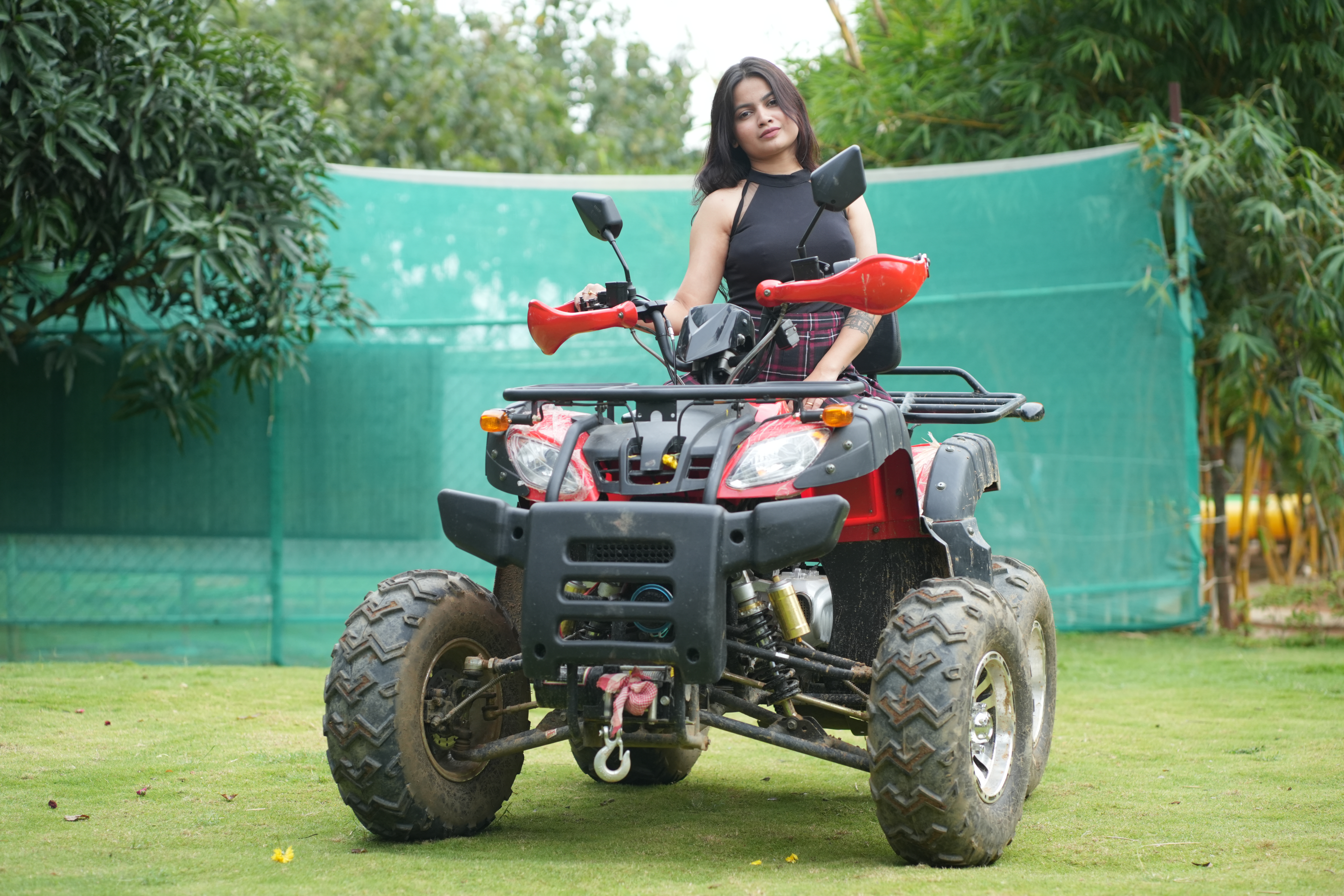 Guest riding an ATV quad bike at the adventure park in Suggee Resort Bangalore